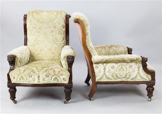 A pair of early Victorian carved walnut low seat armchairs, H. 3ft.